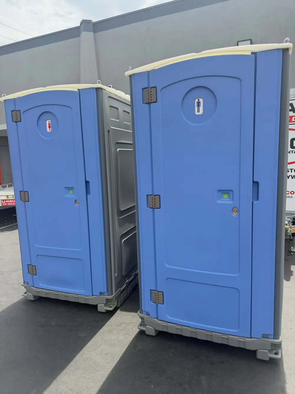 Portable toilet with a built-in sink