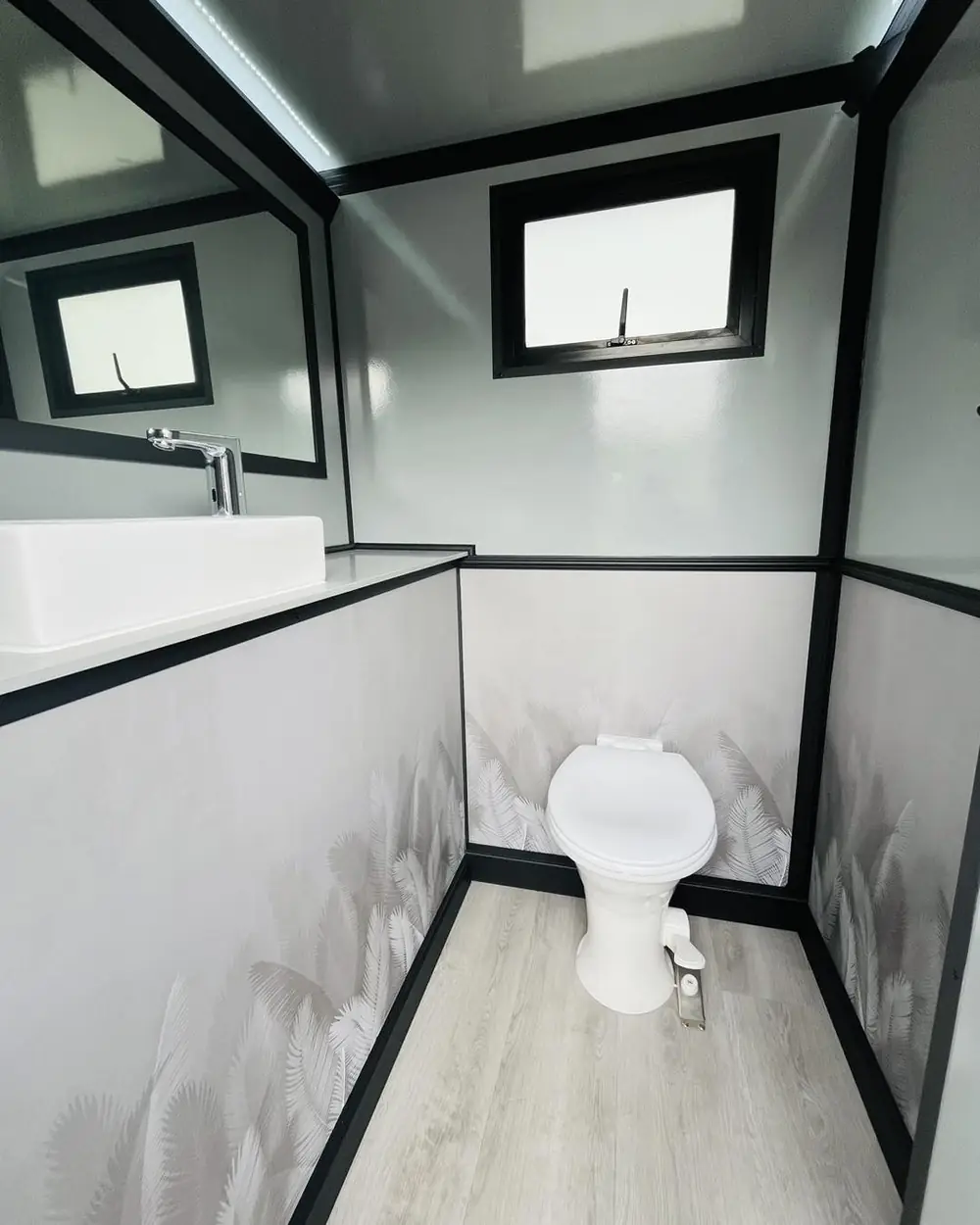 Trailer stall with vanity and toilet