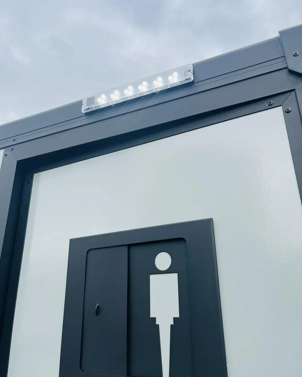 Men's room sign on a restroom trailer