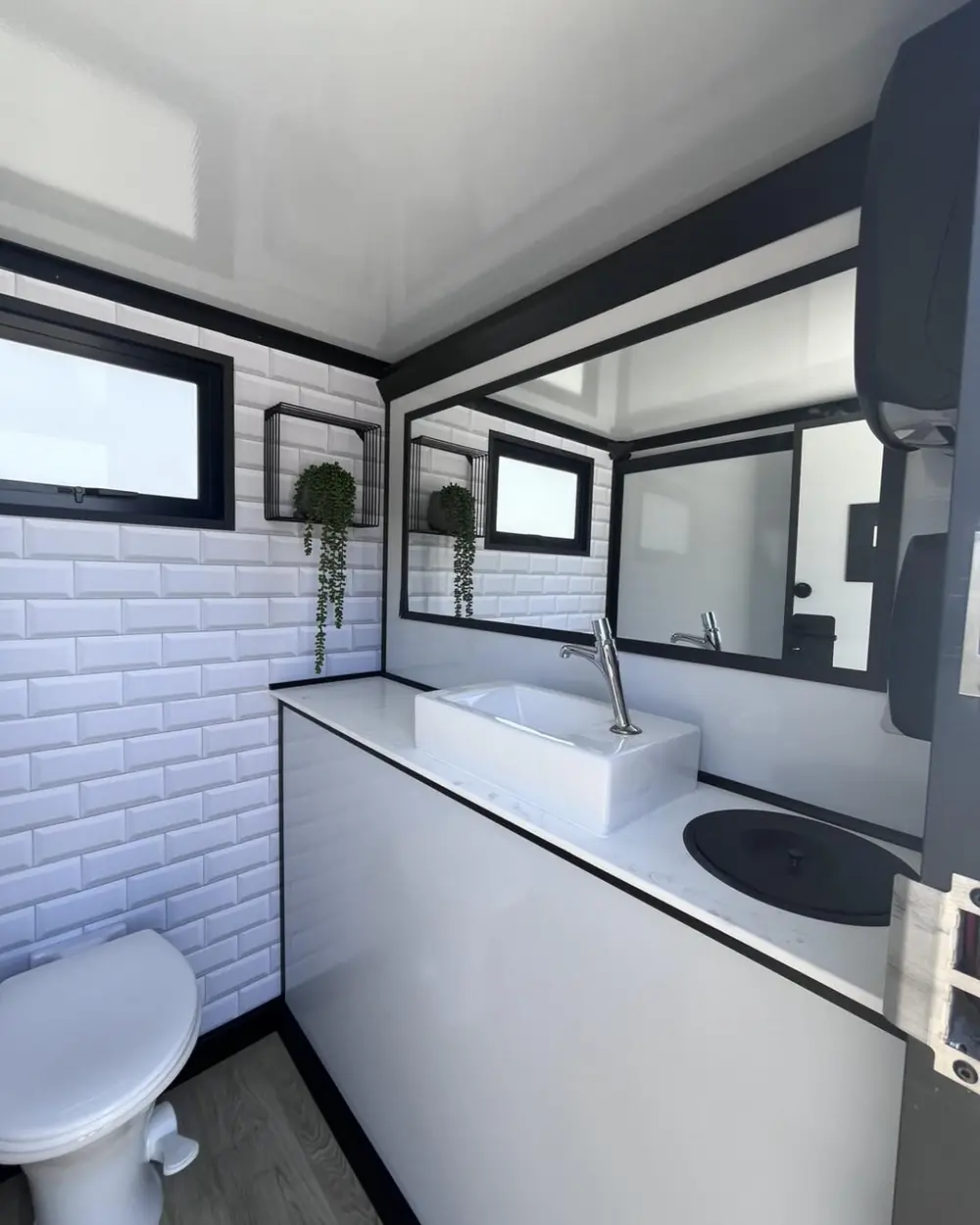 Trailer stall with toilet and sink
